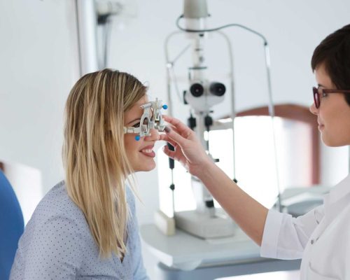 woman-doing-eye-test-with-optometrist-in-eye-sight-2SKW9E6.jpg